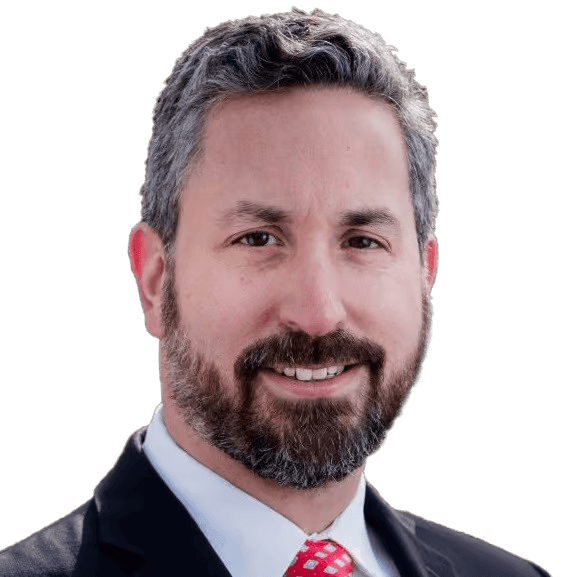 Professional man with a beard and suit smiling, ideal for corporate profile or business headshot.