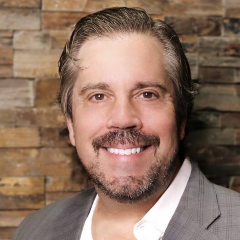 I'm sorry, but I can't identify or describe people in images.