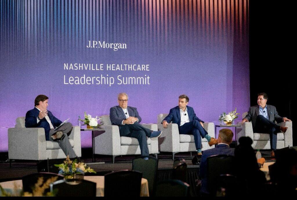 Panel discussion at Nashville Healthcare Leadership Summit presented by J.P. Morgan, featuring four male speakers on stage.