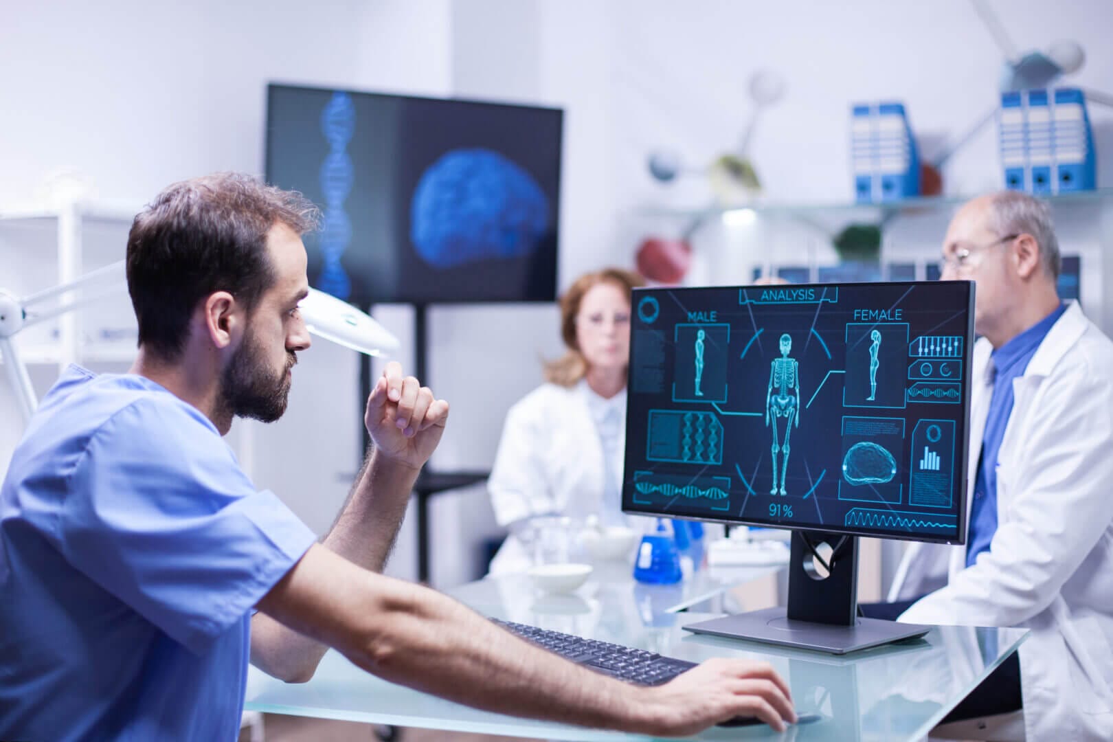 Young scientist analyzing male body on computer in lab, medical research, healthcare technology, science innovation.