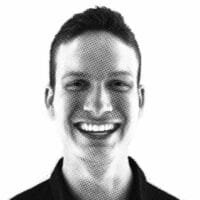 Halftone illustration of a smiling person with short hair, emphasizing graphic art style and positive expression.